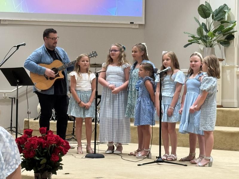 Kids singing in church worship